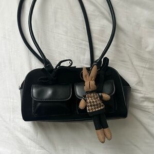 Elegant Black Women's Handbag with Plush Charm